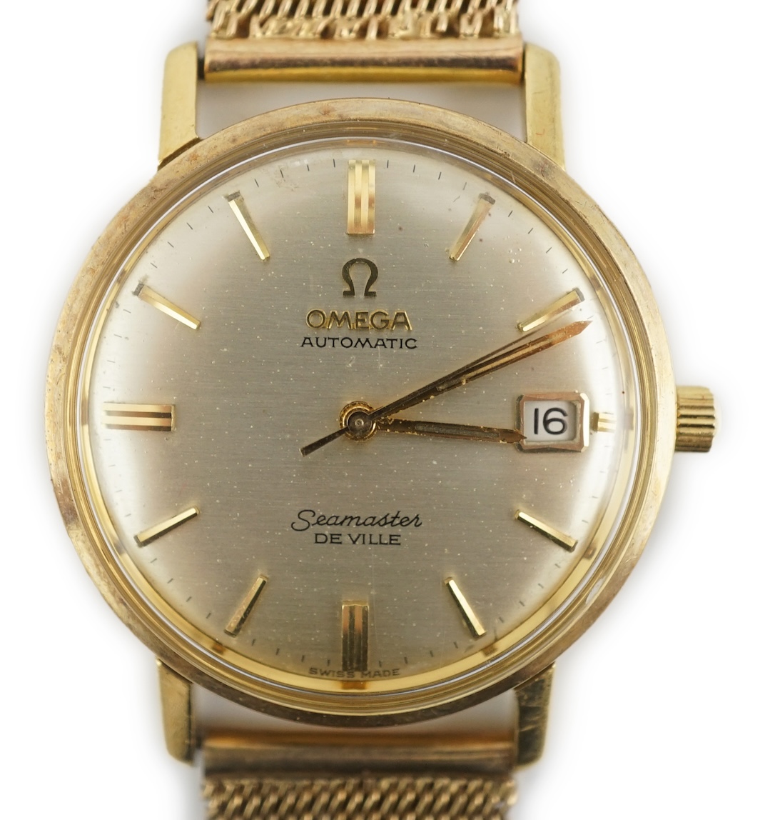 A gentleman's 1960's 18ct gold Omega Seamaster DeVille automatic wrist watch, on an associated 9ct gold bracelet